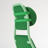Green gaming chair backrest detail: mesh, adjustable straps, cushioned headrest, durable frame.