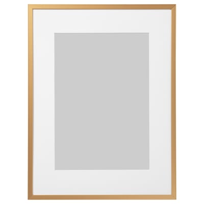 Golden picture frame with white inner mat, square shape, slim metallic design.