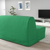 Green lycksele sofa in modern living room with art and plant.