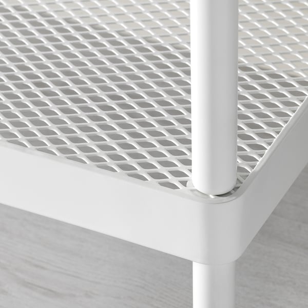 Close-up of white metal mesh shoe rack, showing sturdy, powder-coated frame and durability.