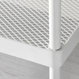 Close-up of white metal mesh shoe rack, showing sturdy, powder-coated frame and durability.