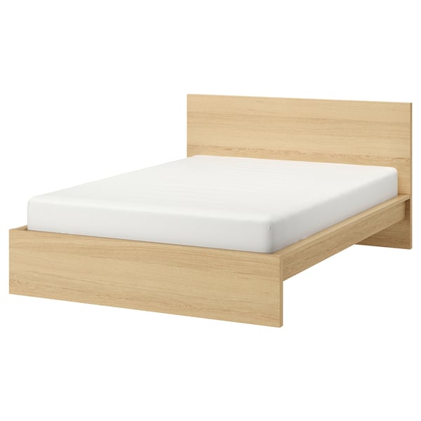 MALM light oak bed with white mattress. Simple, rectangular design with high wooden headboard. Clean lines, solid wood veneer finish.