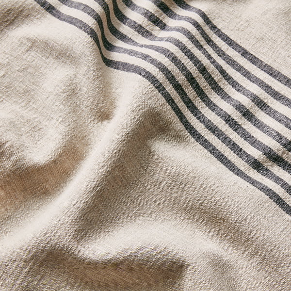 Close-up of striped cotton-linen blend, soft texture, neat seams, touch fastener.