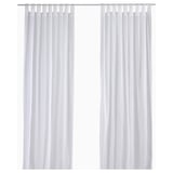 MATILDA sheer white curtains, made of 100% cotton, hang straight with a tab heading, diffusing light for privacy.