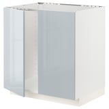 A white METOD kitchen cabinet with a modern design, featuring a glass door and polished edges, perfect for a stylish kitchen setup.