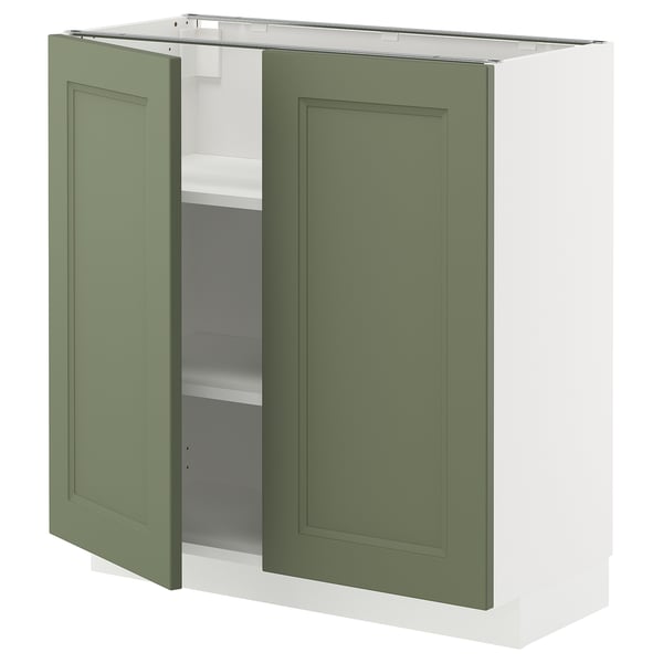 An open greenish-gray METOD kitchen cabinet with adjustable shelves.