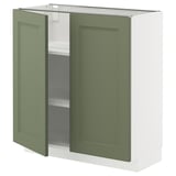 An open greenish-gray METOD kitchen cabinet with adjustable shelves.