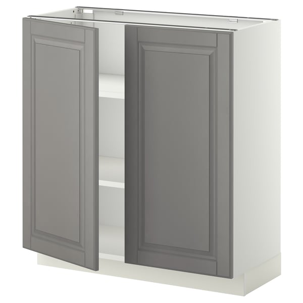 This image shows a grey, ikea METOD kitchen cabinet with two open doors, featuring beveled edges and adjustable shelves.