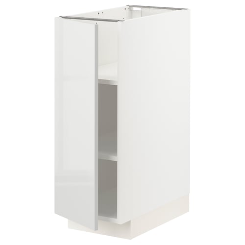White kitchen cabinet, modern design, glossy finish, rectangular shape. Part of the METOD system, sturdy build with adjustable shelves.