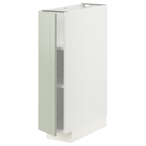 Depicts a METOD kitchen cabinet with green stensund doors and a white frame. It snap-on hinges with dampers and adjustable shelves.