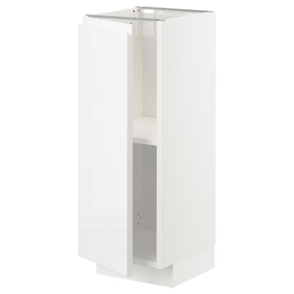 A white METOD kitchen cabinet with a sleek, modern design and a high gloss finish. It adjustable shelves and a minimalist, handle-less door.