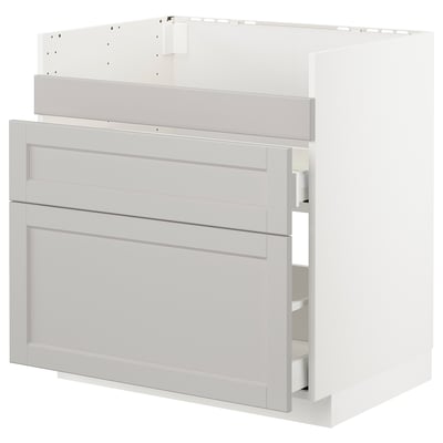 A white METOD kitchen cabinet with grey lerhyttan fronts, bevelled edges, and three drawers.