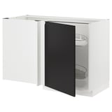 A modern white corner base cabinet with a black door from the METOD kitchen system. It has pull-out shelves for accessible storage.