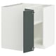 A white METOD kitchen cabinet with a grey-green door and adjustable shelves.
