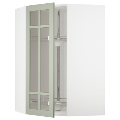 A green ikea METOD kitchen cabinet with glass door and a carousel shelf inside, designed for organized storage.