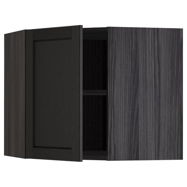 Black stained kitchen cabinet with one open door, dark wood grain.