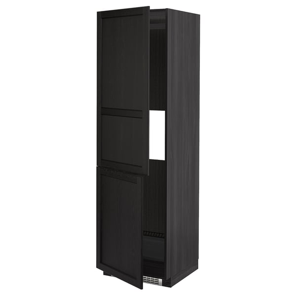 Black wooden kitchen cabinet with beveled edges, two doors open, white shelf visible inside.