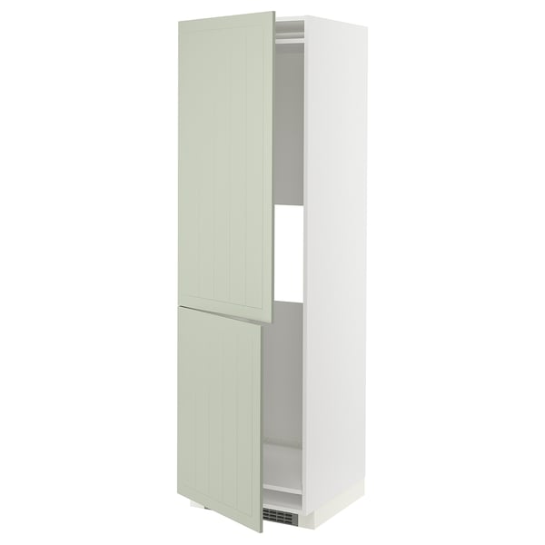 An open, tall, white METOD kitchen cabinet with green stensund doors. It has two adjustable shelves inside.