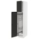 An open METOD kitchen cabinet with black upplöv doors and pull-out organizers, framed in white.