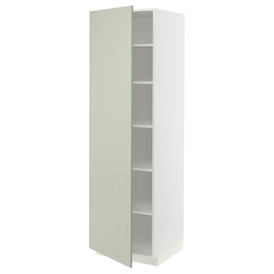 A white METOD kitchen cabinet with a light green stensund door, featuring vertical grooves, and three adjustable shelves inside.