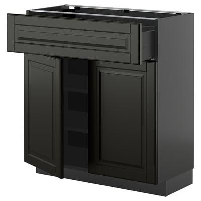 Black METOD kitchen cabinet with beveled bodbyn fronts, featuring doors and drawers. Modern, sleek design with soft-close drawers.
