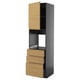 Modern black kitchen unit with oak drawers and cabinet for microwave.