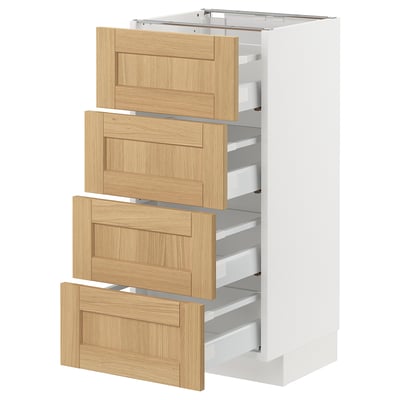 A white METOD kitchen cabinet with four oak veneer drawers. The cabinet is sleek and modern, with a classic, warm wooden look.