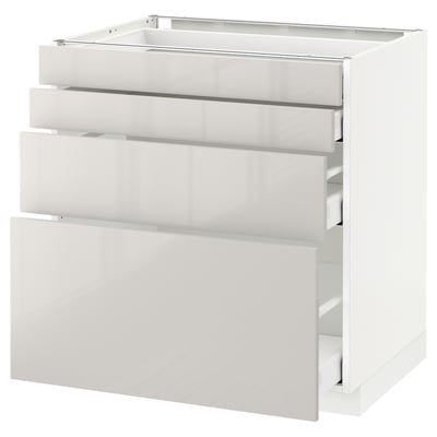 White METOD kitchen unit with multiple drawers.