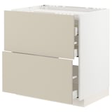 Modern kitchen cabinet with beige drawers, white frame. Three drawers, sleek design.