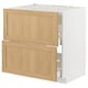 Modern kitchen cabinet with oak drawers and white frame.