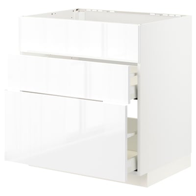 White modern kitchen cabinet with sleek design and smooth drawer.