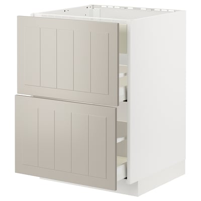 Displays a beige METOD kitchen cabinet with two drawers, designed with a modern, crafted aesthetic.