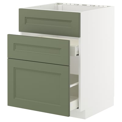 Modern kitchen cabinet unit with four green drawers on a white base.