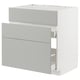 Modern light grey kitchen unit with sleek handles and drawers.