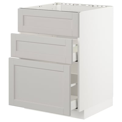 White kitchen cabinet with drawn-out drawer and shelves.