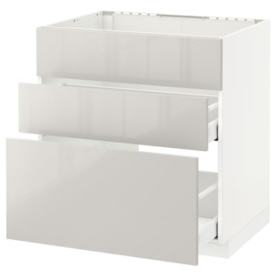 White METOD kitchen unit, glossy finish, rectangular shape with two open drawers.