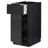 Black kitchen cabinet with drawer open, wire racks visible, modern design.