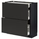 Black METOD kitchen cabinet with three drawers, sleek modern design.