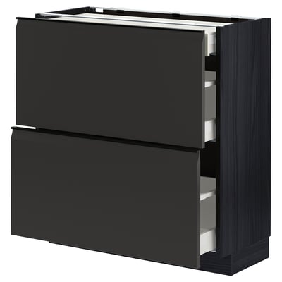 Modern black kitchen unit with three drawers and sleek handle-less design.