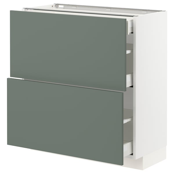 Modern grey-green kitchen cabinet with drawers and doors by IKEA.