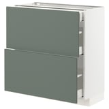 Modern grey-green kitchen cabinet with drawers and doors by IKEA.