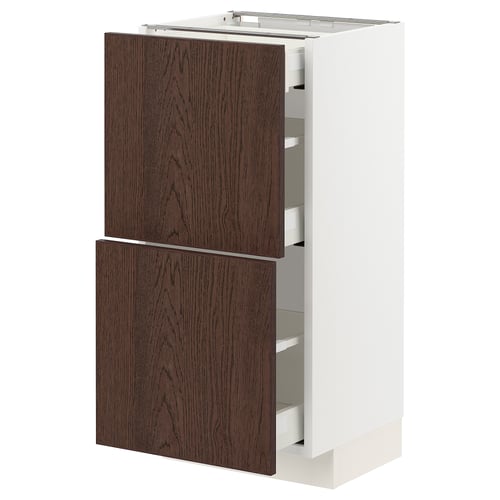 Modern kitchen unit: METOD with dark brown sinarp drawers, sleek white cabinet, wooden edges, featuring multiple drawers.