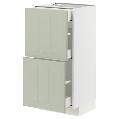 A light green METOD kitchen cabinet with two drawers and two doors, featuring a sleek and modern design.
