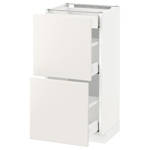 This image shows a white ikea METOD kitchen cabinet with two drawers and a cupboard on top. It is sleek and modern in design.