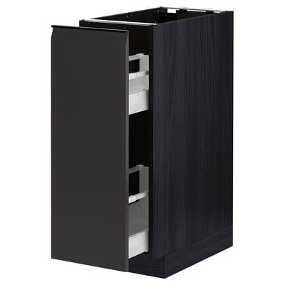 Black METOD kitchen cabinet with dark wood grain, partially open with pull-out drawers.