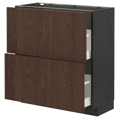 METOD kitchen unit with dark brown oak veneer drawers and solid wood edging, black frame.