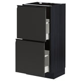 Modern kitchen unit, METOD, in matte black with sleek, handleless fronts and smooth drawers.