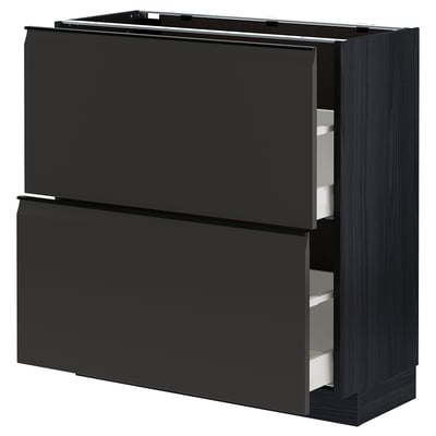 Modern black METOD kitchen cabinet with sleek, handle-less, square drawers.