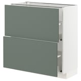 IKEA METOD kitchen cabinet with grey-green drawers and white frame, modern and sleek design.