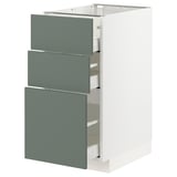 Modern IKEA METOD kitchen cabinet with 3 drawers, sleek, self-closing.